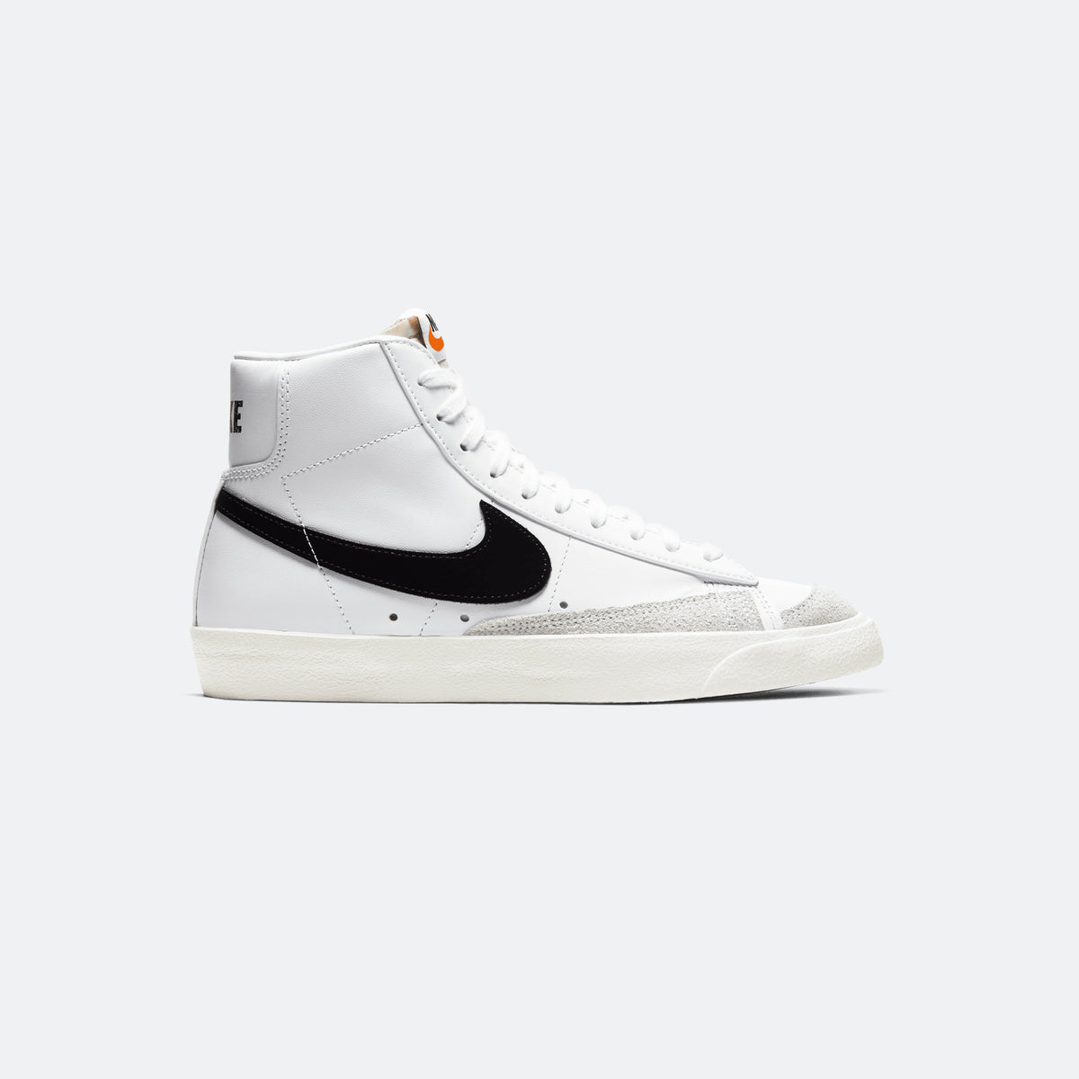 White Nike Blazer Mid '77 sneaker with black swoosh and cream sole