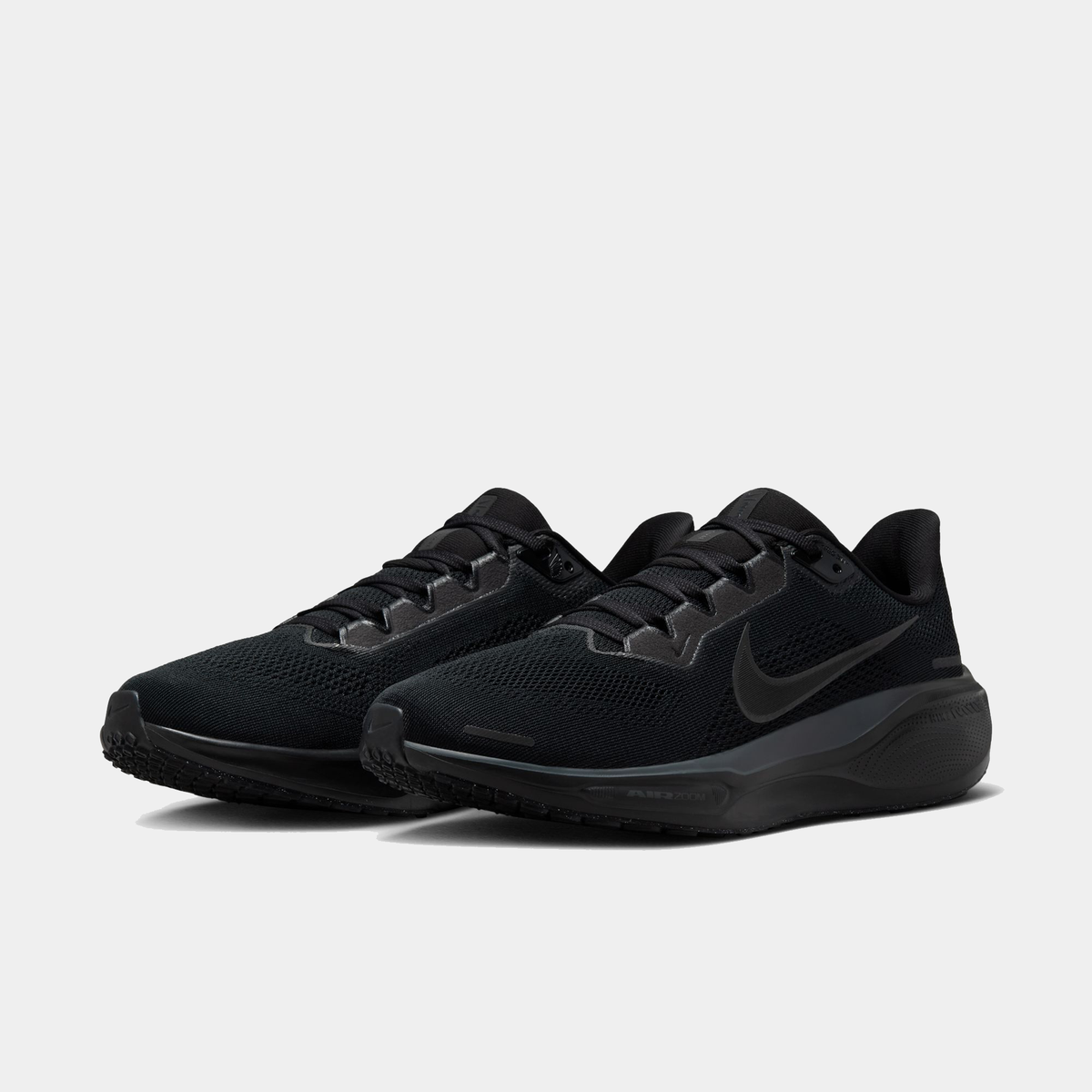 Black running shoes pair with mesh upper, lace-up front, and Nike swoosh