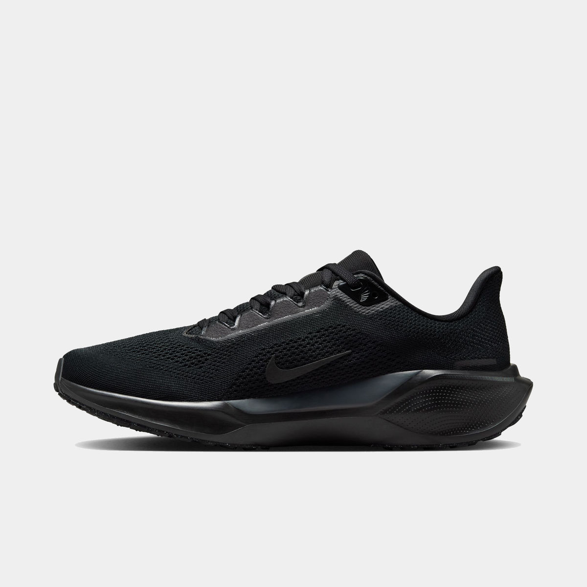 Black running sneaker side profile with textured midsole and Nike swoosh
