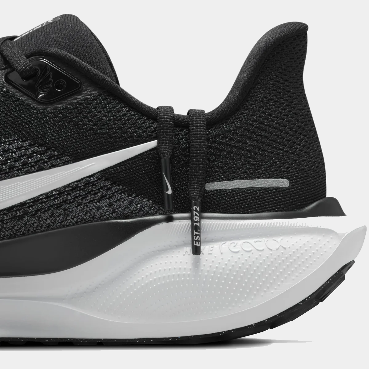 Close-up of black running shoe heel with white Zoom Air cushioning