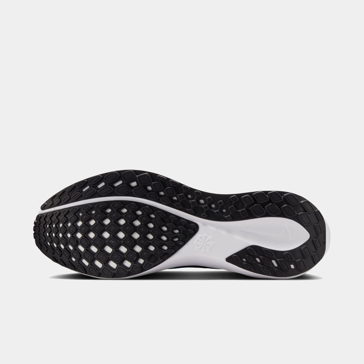 Black and white shoe outsole with textured traction pattern