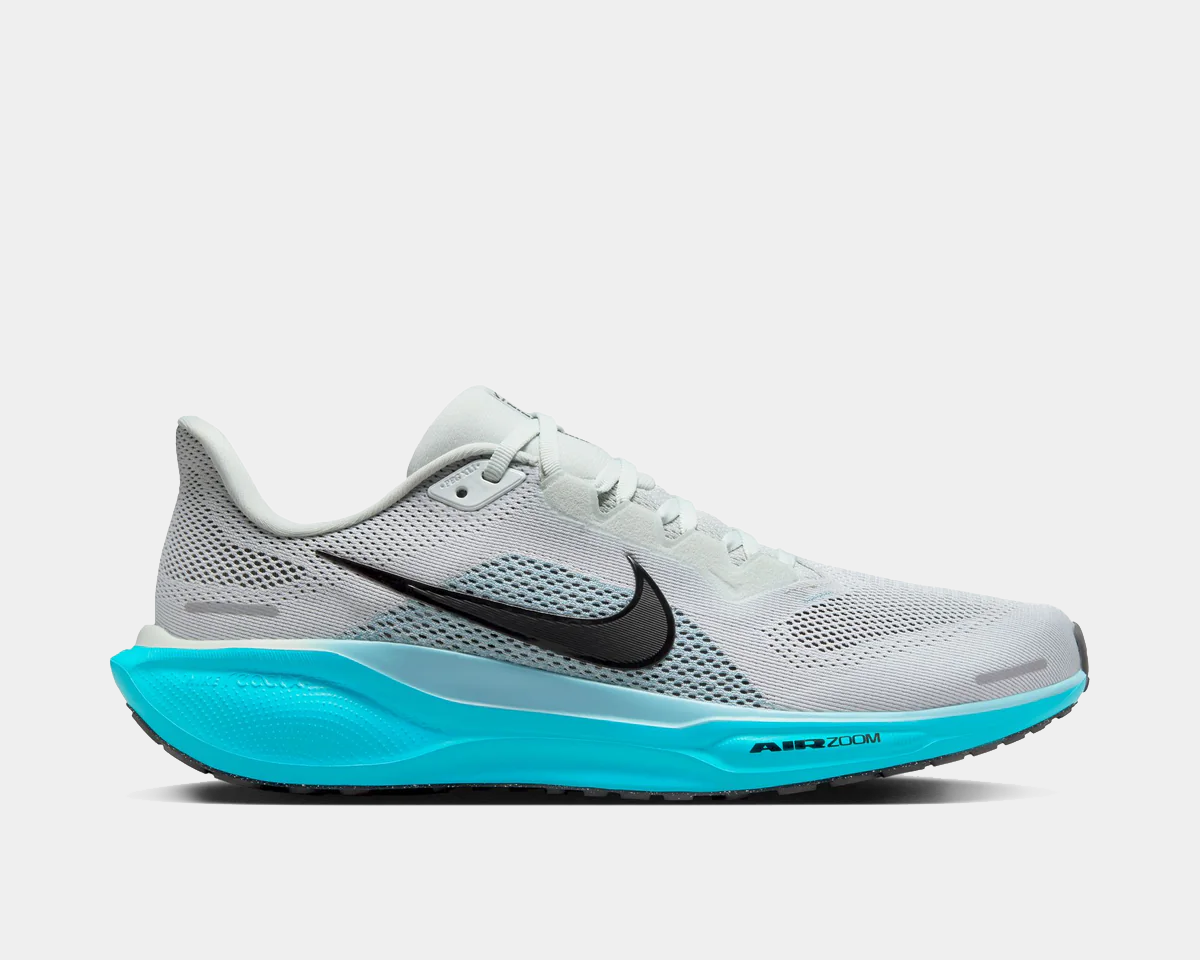 White running shoes with black swoosh, teal sole, and breathable mesh upper