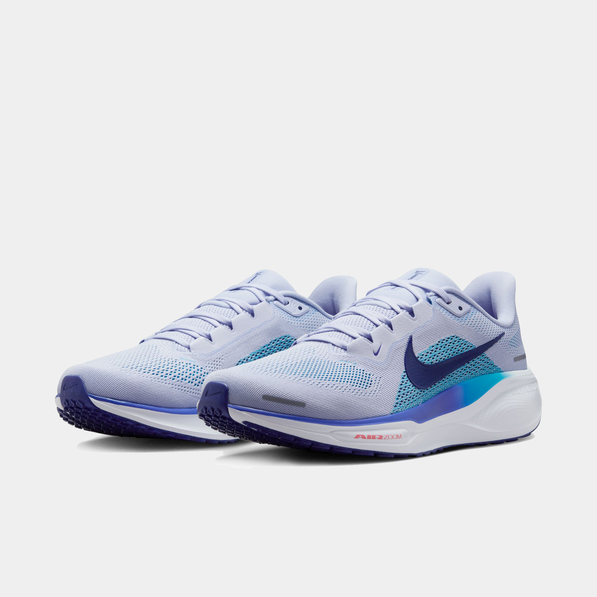 Light blue running shoe pair with teal swoosh accents and cushioned sole