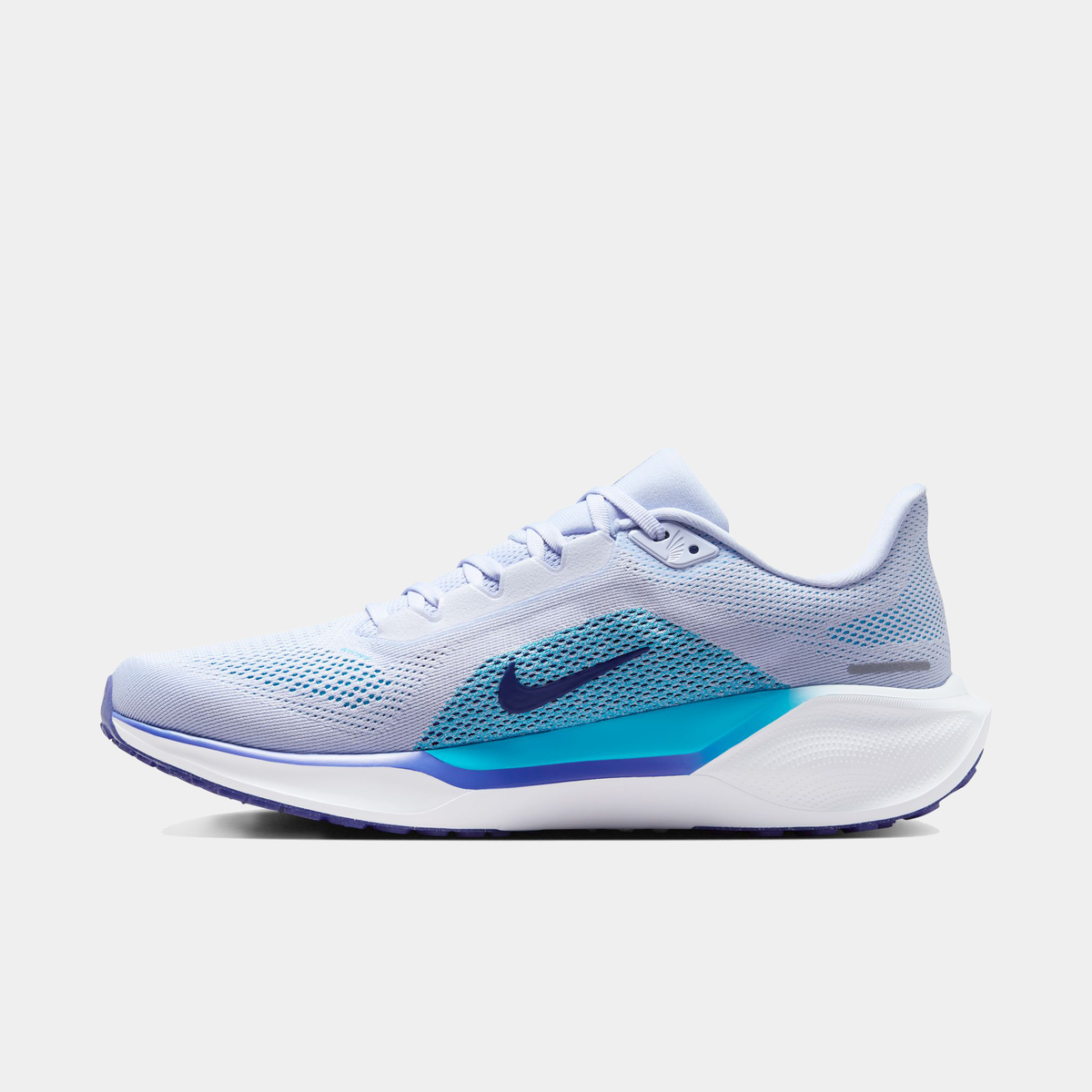 Light blue running shoe with teal Nike swoosh and white cushioned sole
