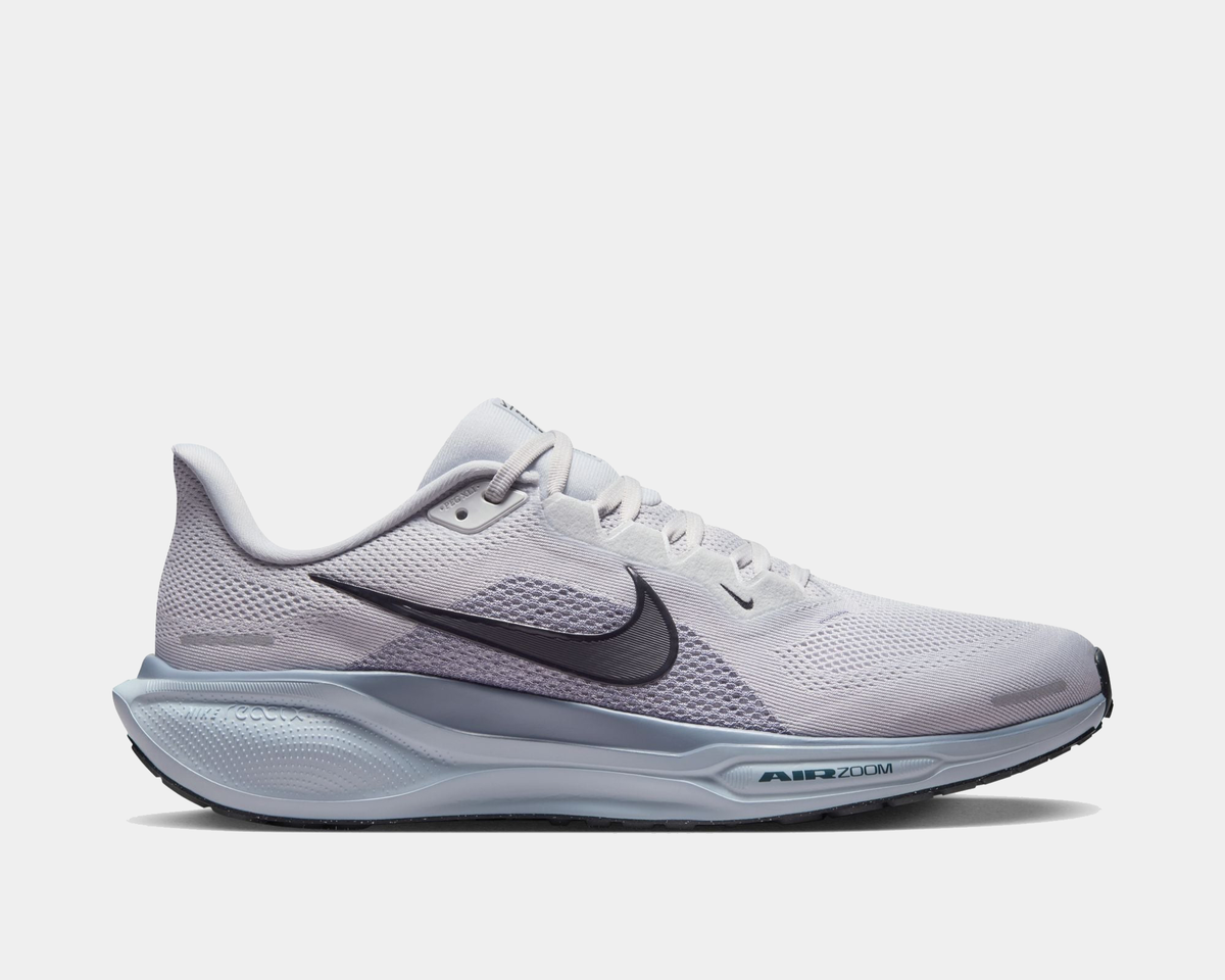 Light gray running shoe with Air Zoom branding, lace-up mesh upper, dark swoosh