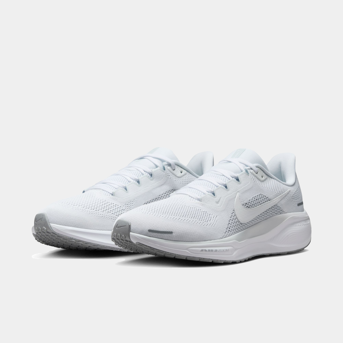 White Air Zoom running shoes pair with mesh upper and lace closure