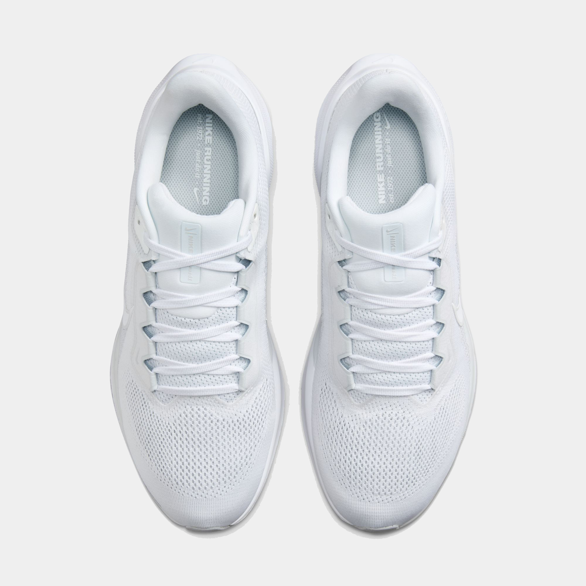 White running shoe front view with perforated mesh and lace-up eyelets
