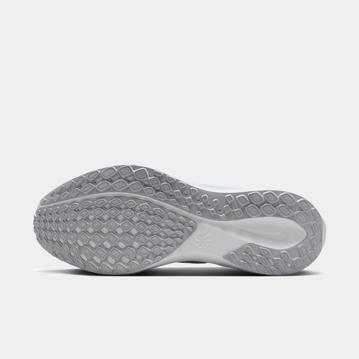 Light gray outsole of a running shoe with diamond traction tread