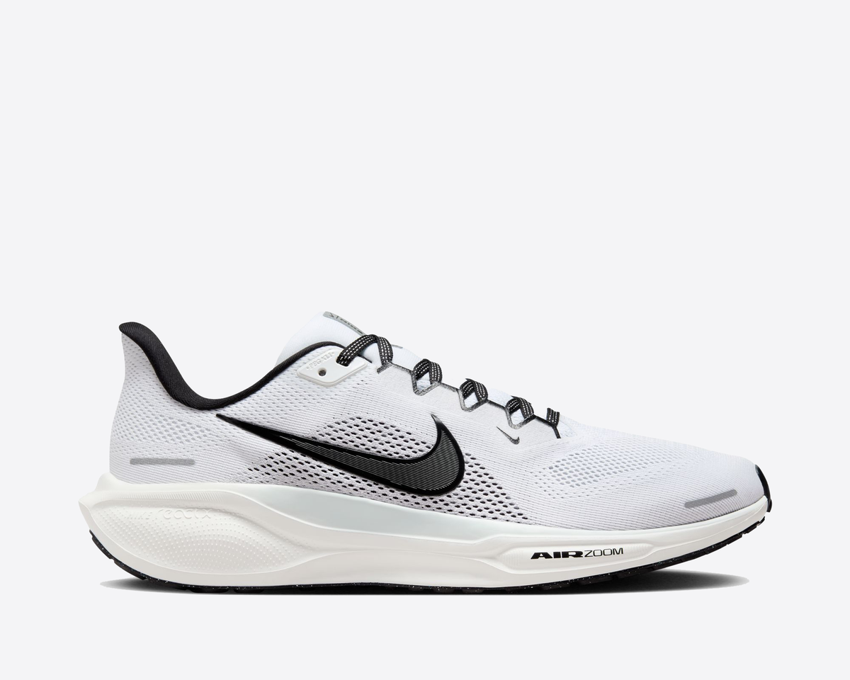 White Air Zoom running shoe with black swoosh, lace-up mesh, and cushioned sole