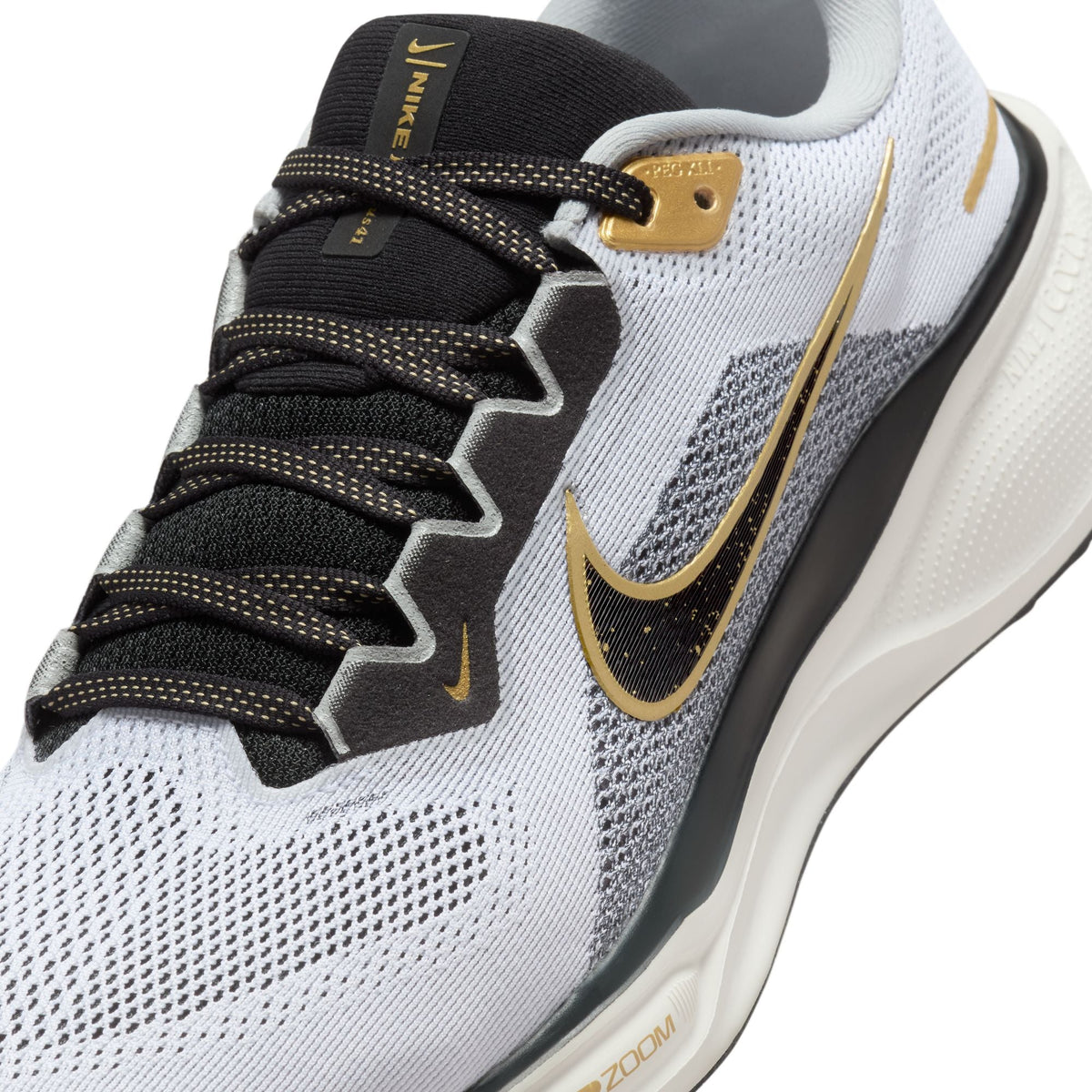 Pegasus 41 running shoes, white mesh with black laces and gold swoosh detail.