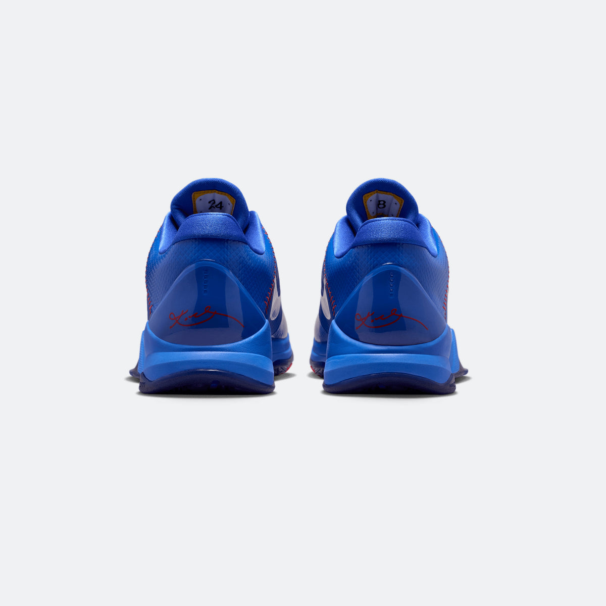 Blue Kobe V Protro sneakers showing red heel graphics and textured sole