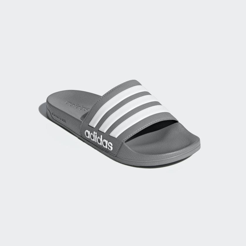 Adilette shower slides gray slide sandal with three white stripes on strap