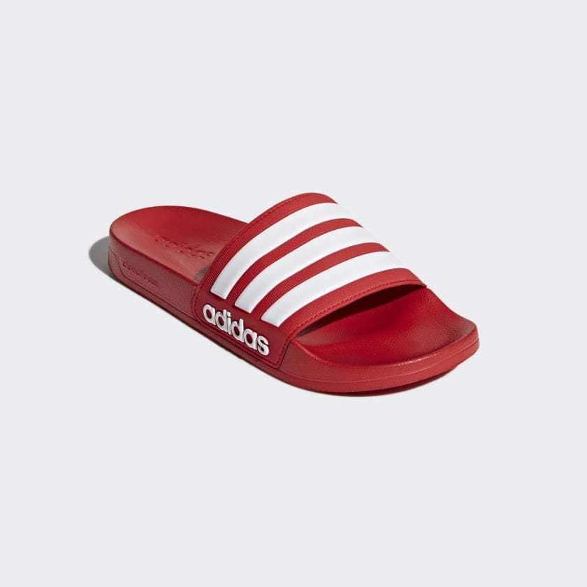 Red Adidas slide sandal with adidas logo, three white stripes on the upper