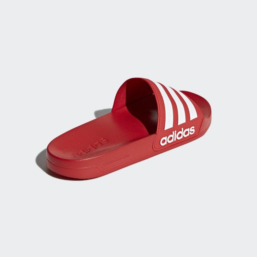 Adilette shower slide sandals in red with white triple stripes and adidas logo