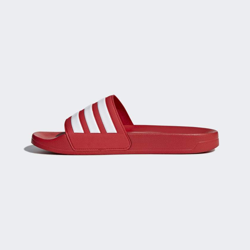Red Adidas slide sandals, open-toe design with three white stripe bands