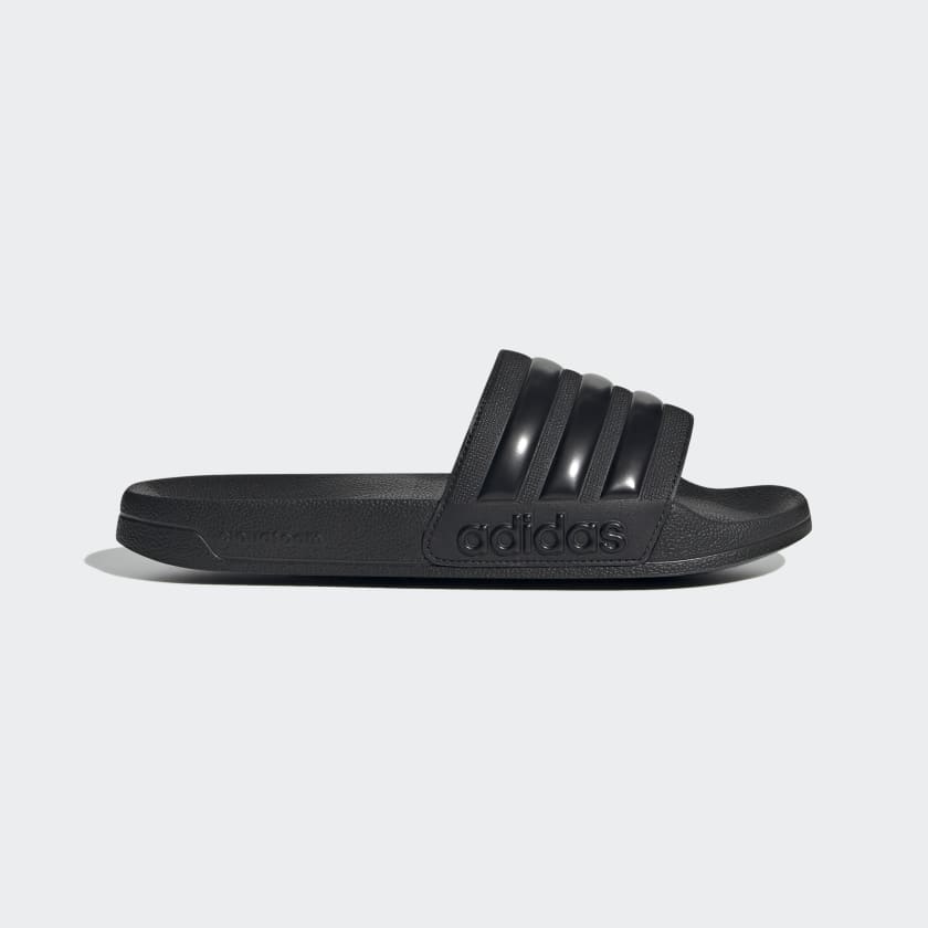 Black adidas slide sandals with triple-bar strap and textured footbed