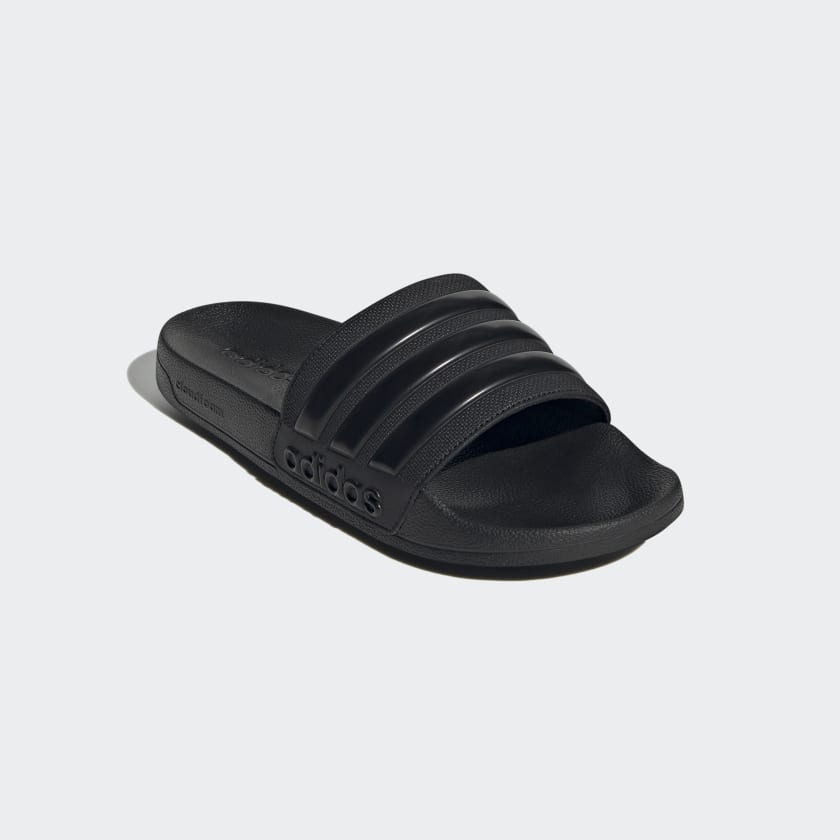 Black adidas slide sandals with three-banded strap and cushioned sole