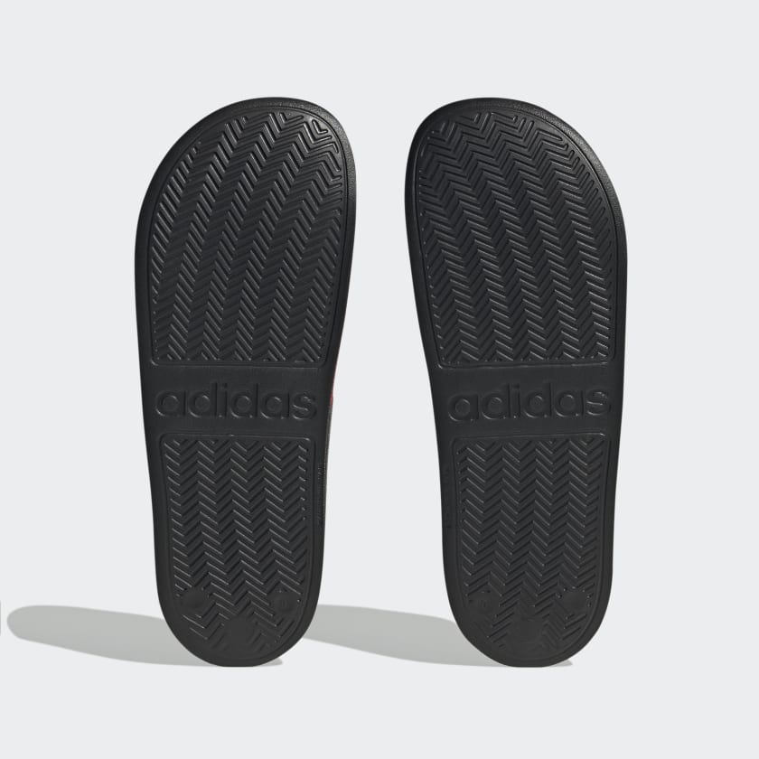 Adilette shower slides outsoles, black textured tread with adidas branding