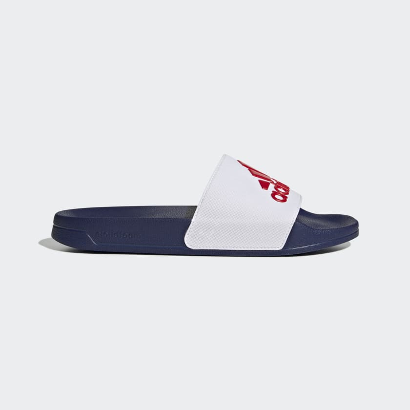Adilette shower slides, navy slide with white strap and red adidas logo accents