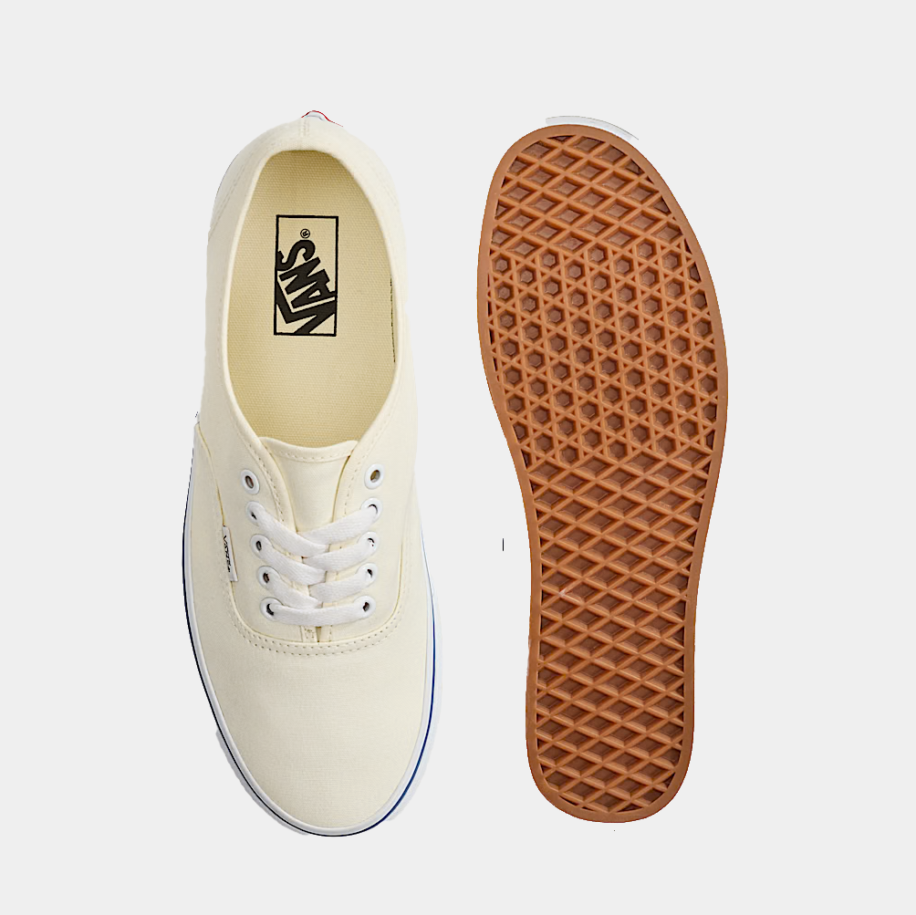 Cream canvas low-top sneakers with white laces; outsole and Vans insole view