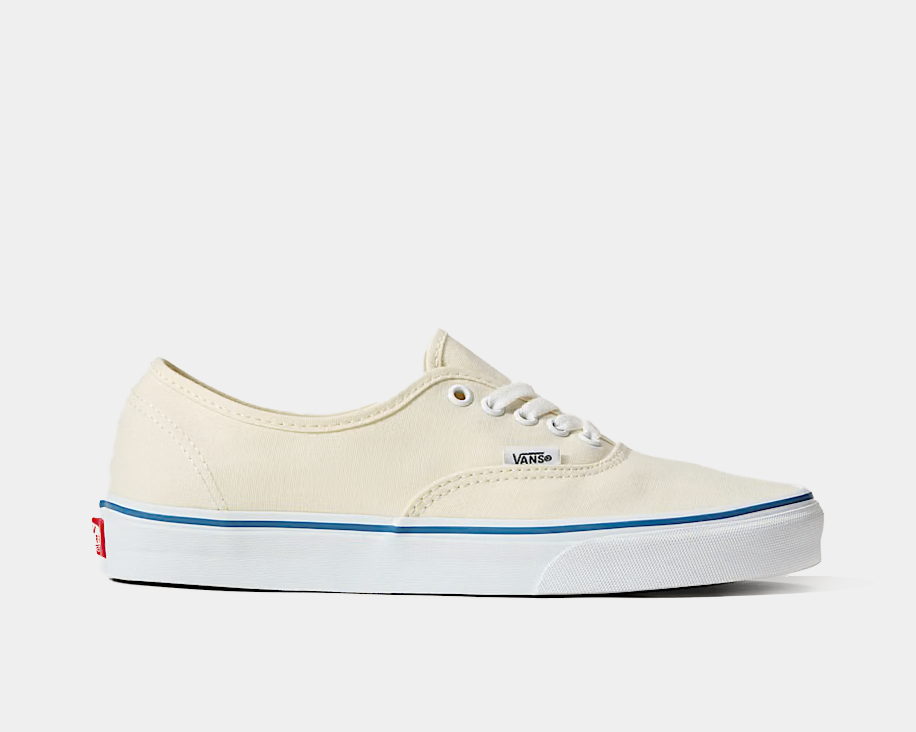 Cream canvas low-top sneakers with white laces and blue side stripe
