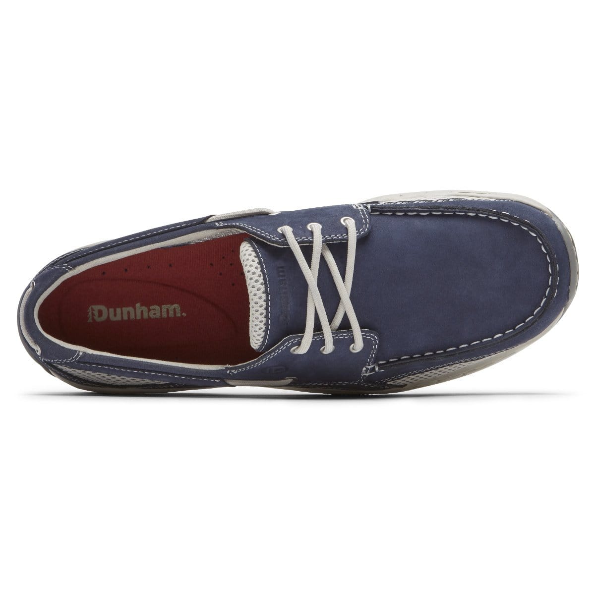Navy lace-up boat shoe with red-brown interior lining and white laces