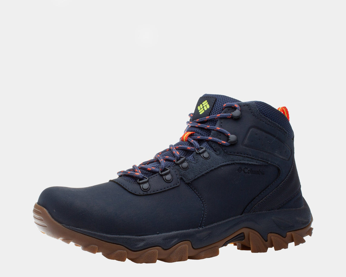 Dark navy waterproof hiking boot with brown outsole and orange/red lace accents.