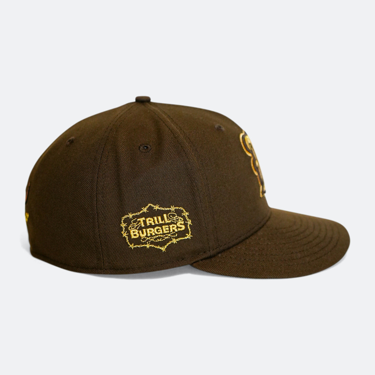 Brown 59Fifty cap with 'Trill Burgers' logo patch