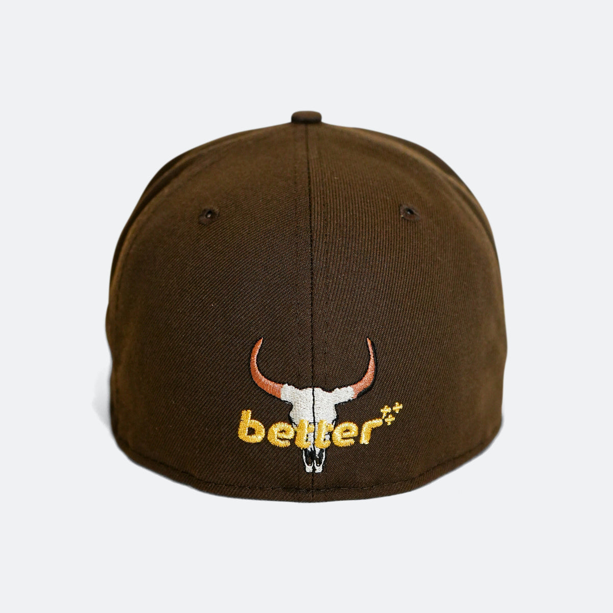 Brown 59Fifty cap with Better text and white-and-orange bull head graphic