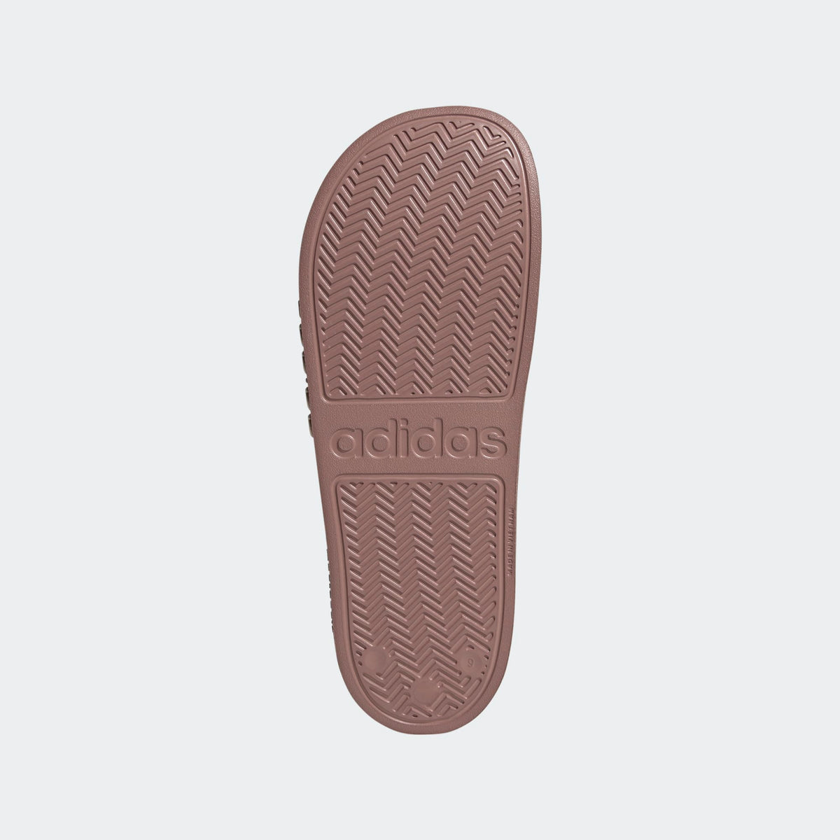 Adilette shower slides mauve outsole with textured chevron pattern and adidas logo