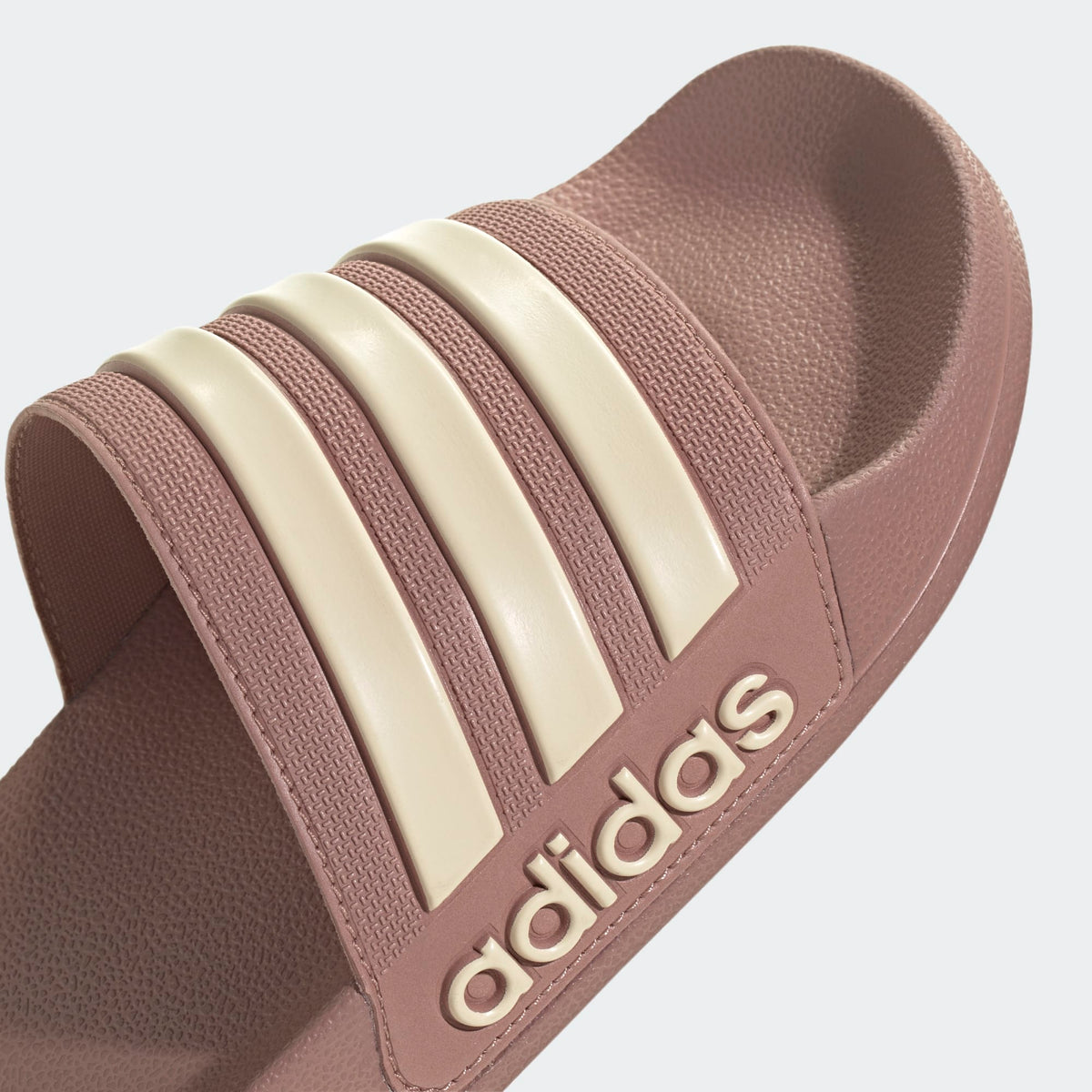 Adilette shower slides mauve upper with cream stripes and adidas lettering on strap