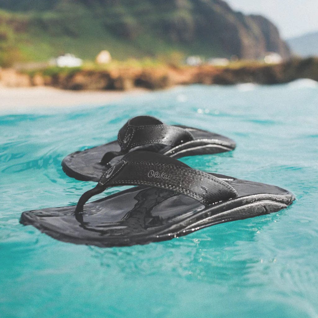 Black rubber flip-flops with thong strap and textured footbed