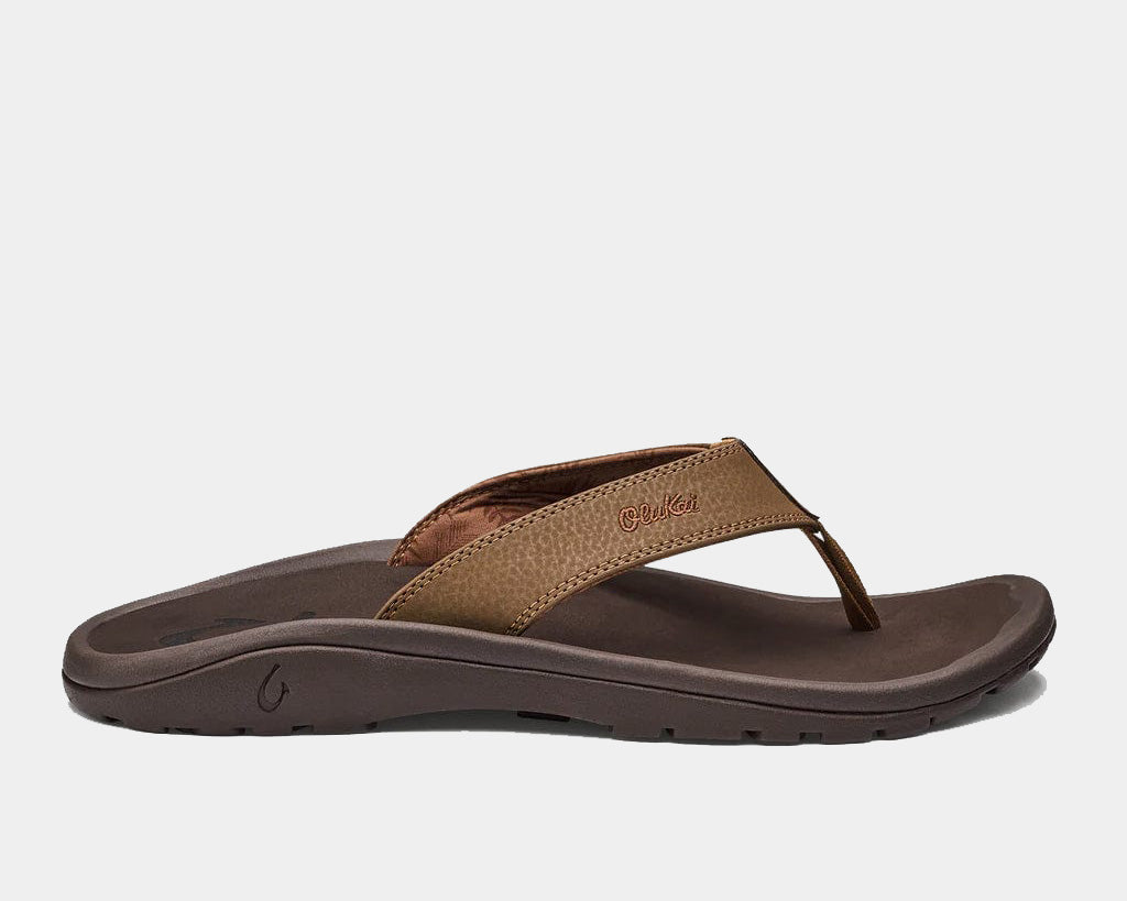 Tan thong sandal with brown straps and dark rubber sole, side view