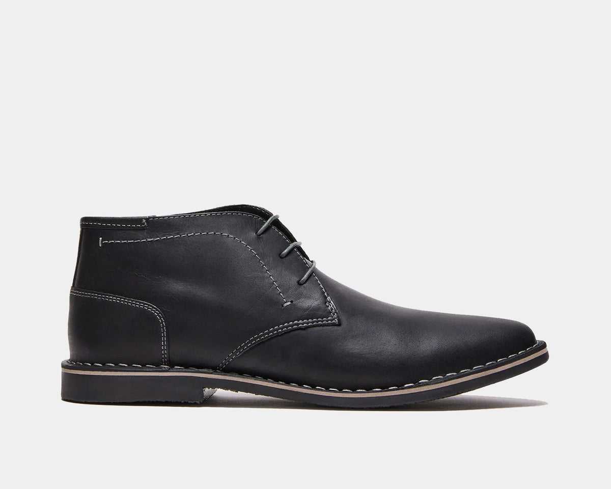 Harken black leather lace-up ankle boot with contrast stitching and low rubber sole.