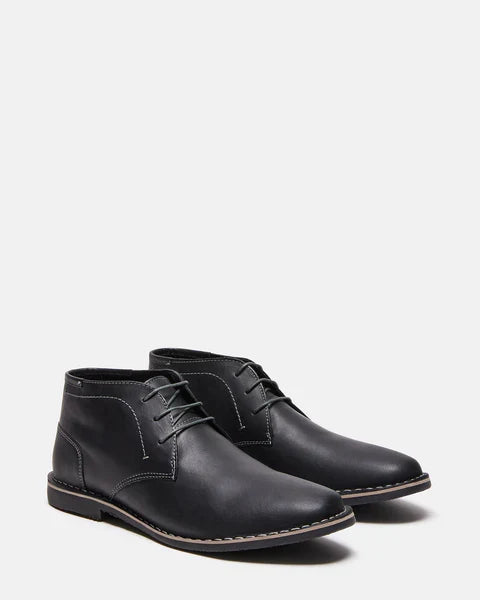 Harken black leather lace-up ankle boots, angled side view with stitched panels.