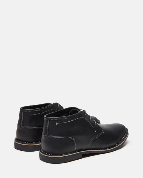 Harken black leather lace-up ankle boots, rear/side view with low stacked heel.