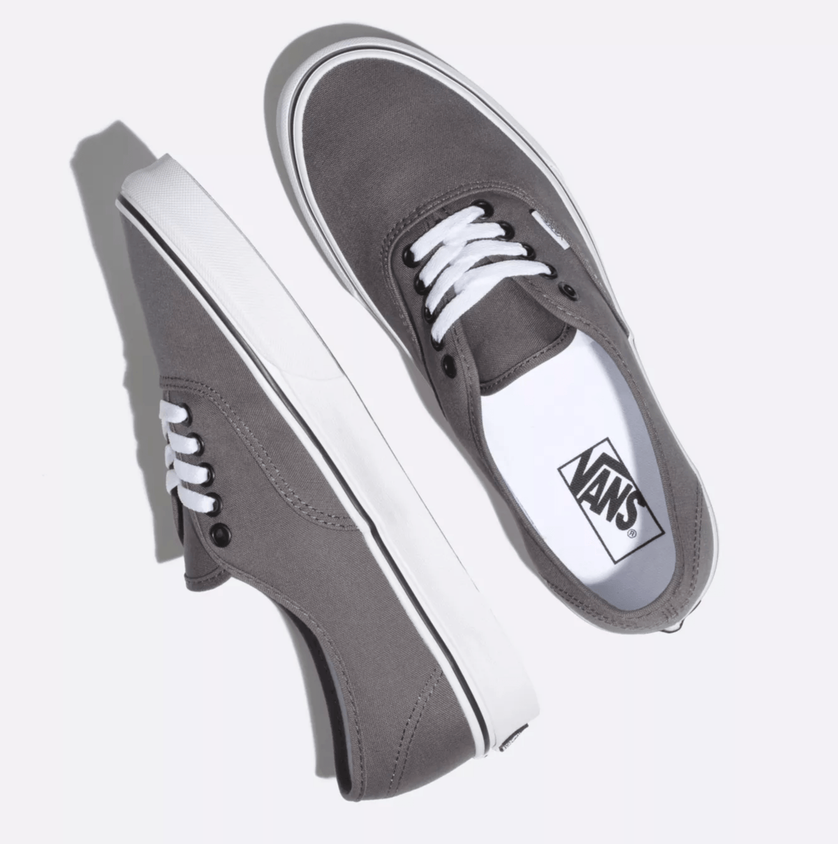 Grey canvas sneakers with white laces and white vulcanized sole, Vans logo tag