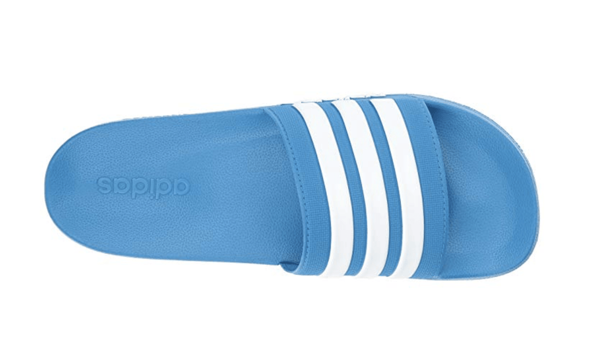 Blue Adilette shower slide sandal outsole view with white triple stripes