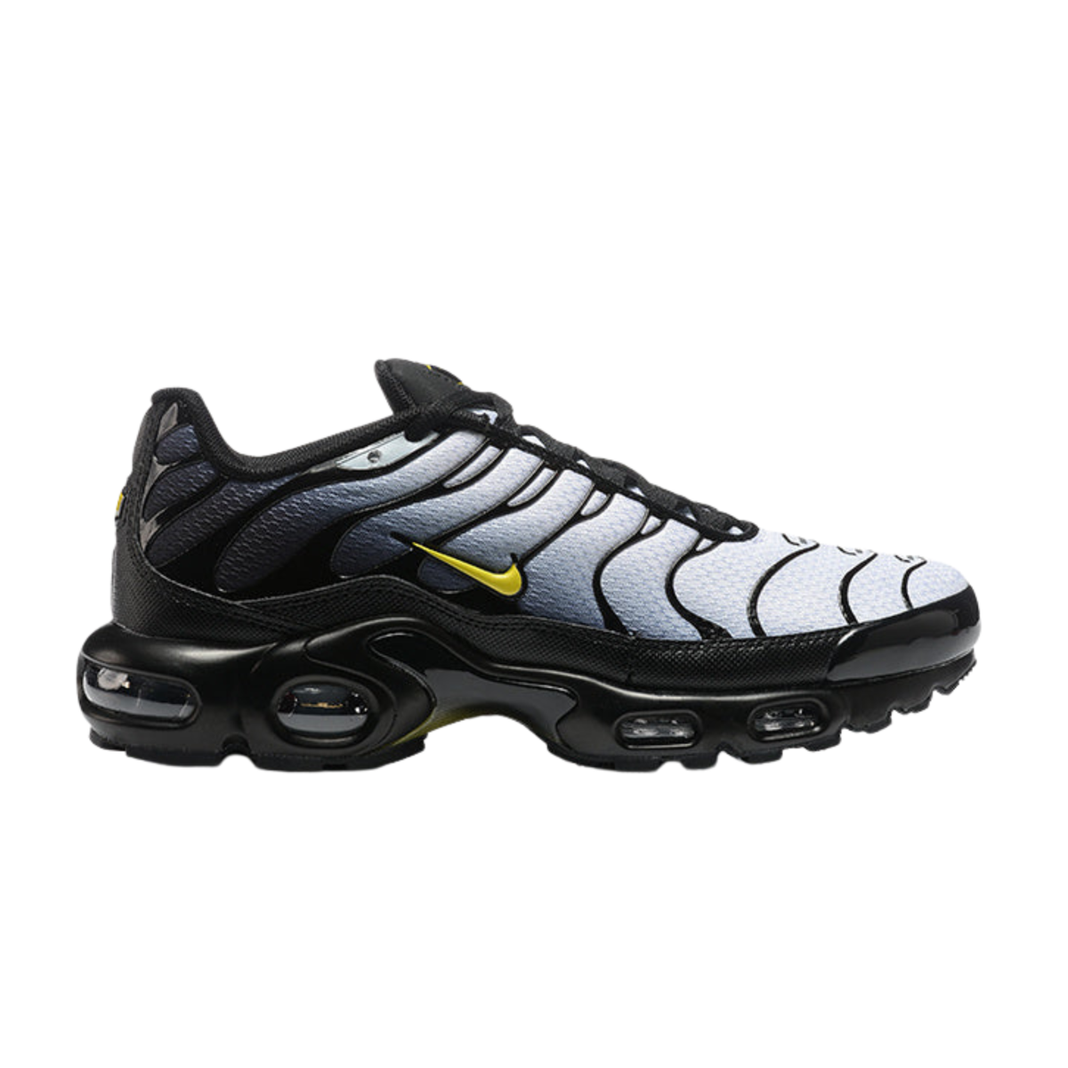 Nike Air Max Plus sneakers, white and black with yellow swoosh, black sole, side view