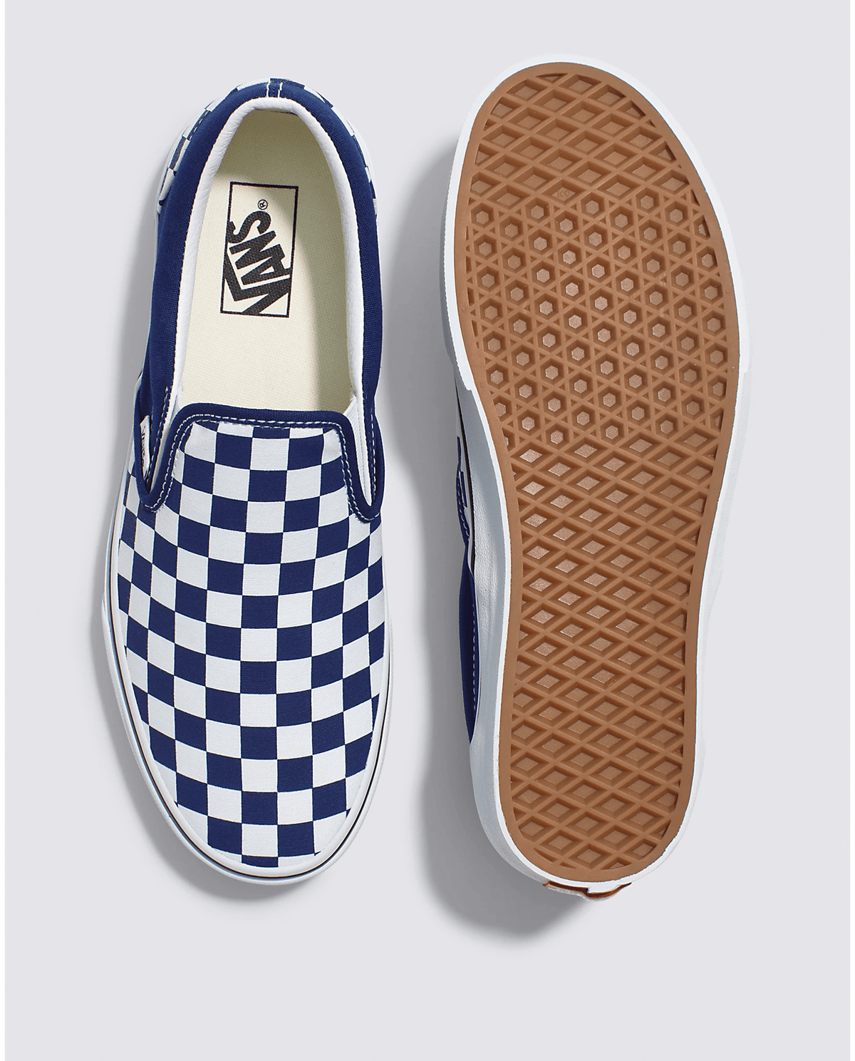 Top view and outsole of blue and white checkerboard slip-on sneakers