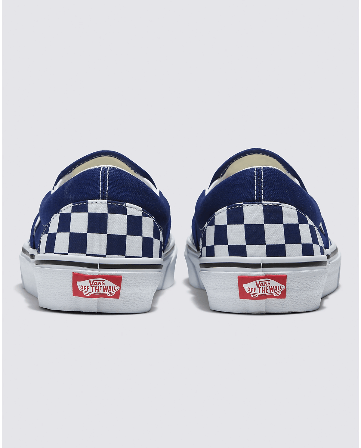Back view of blue and white checkerboard slip-on sneakers with Vans heel tag
