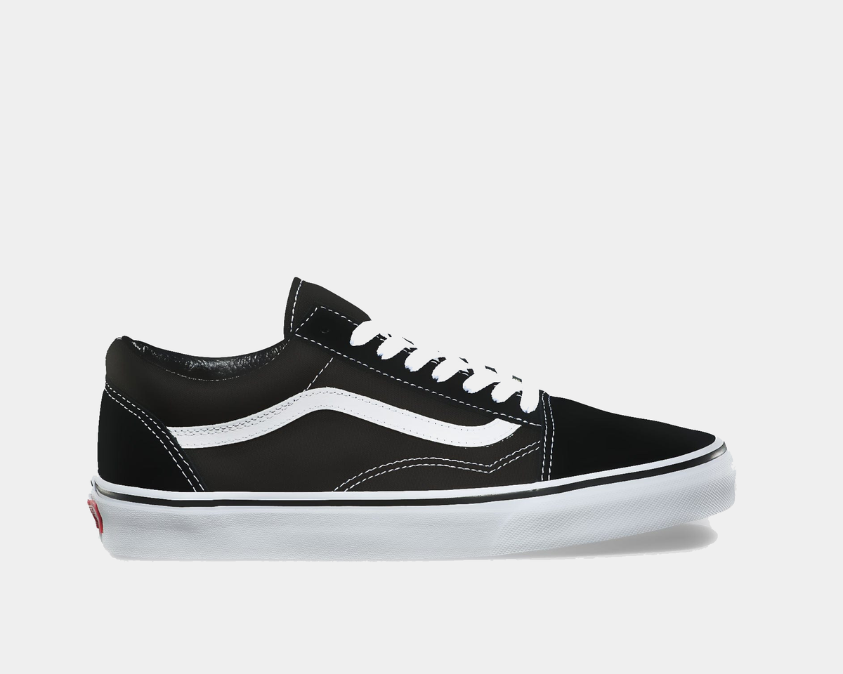 Black and white low-top sneakers with lace-up front, white side stripe, rubber sole