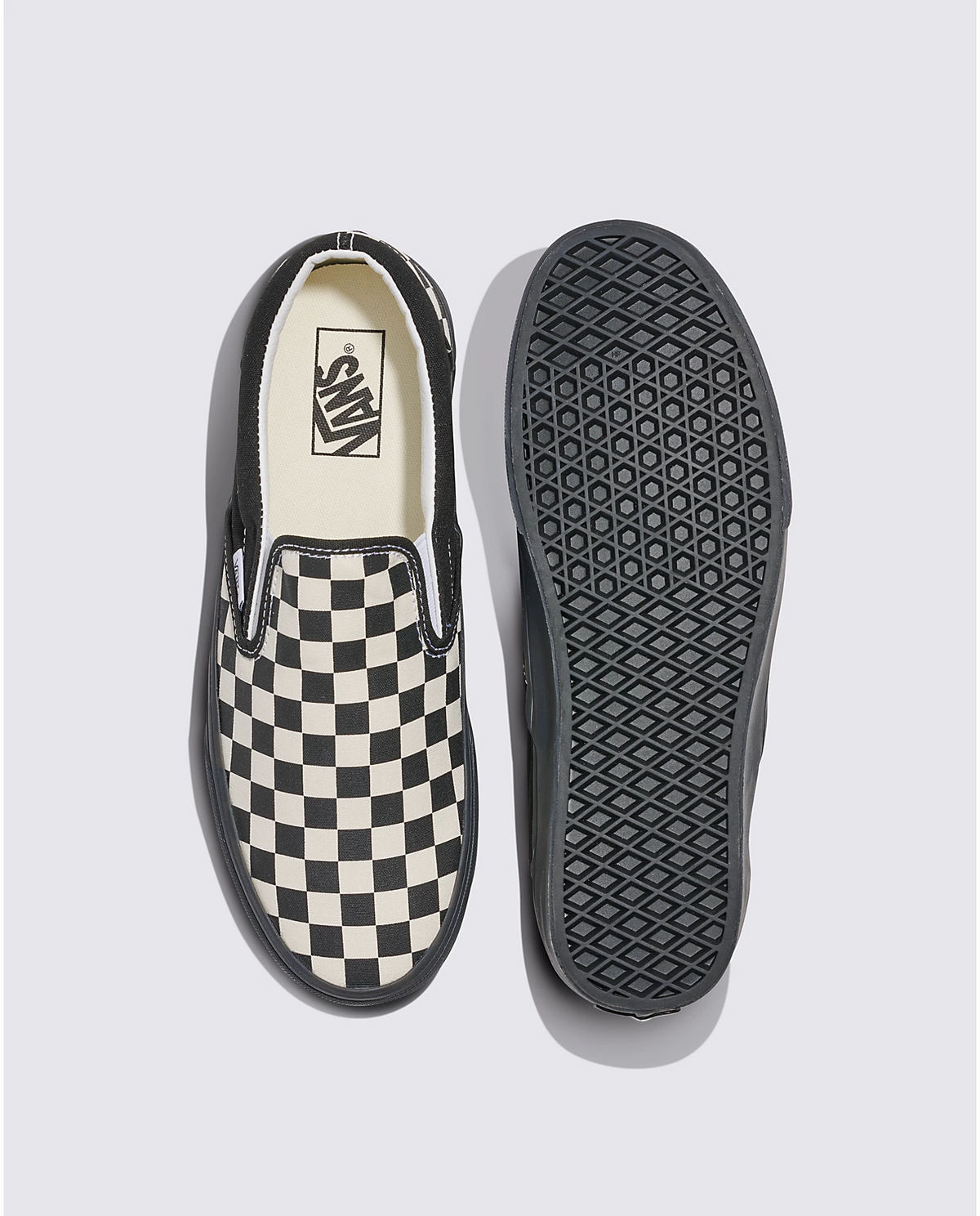 Slip-on sneaker open top and outsole bottom in black-and-white checkerboard pattern.
