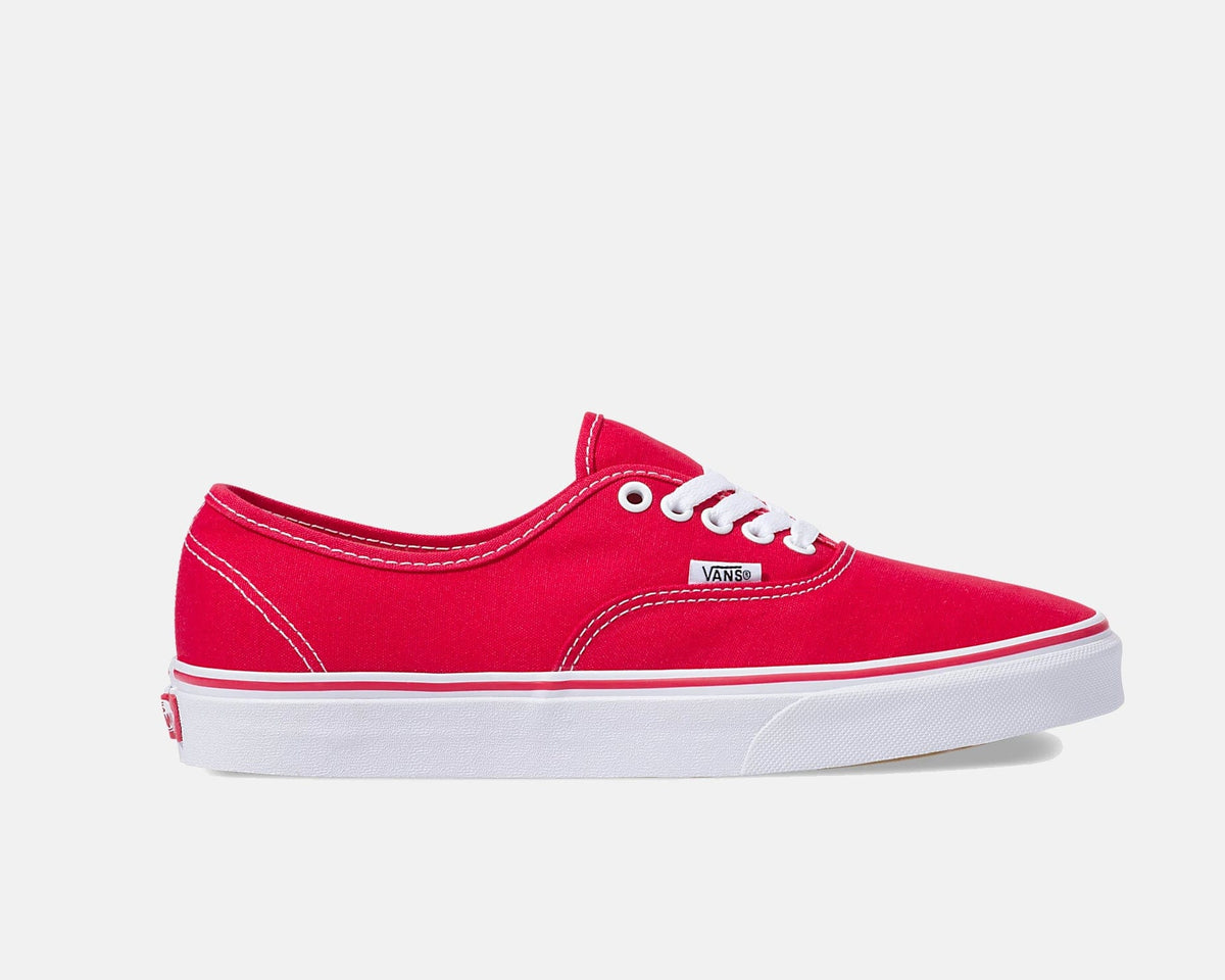 Red low-top lace-up sneakers with white sole and Vans logo at side