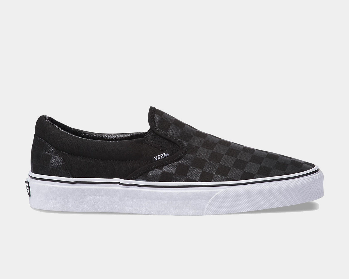 Black checkerboard slip-on sneaker with Vans logo and white rubber sole