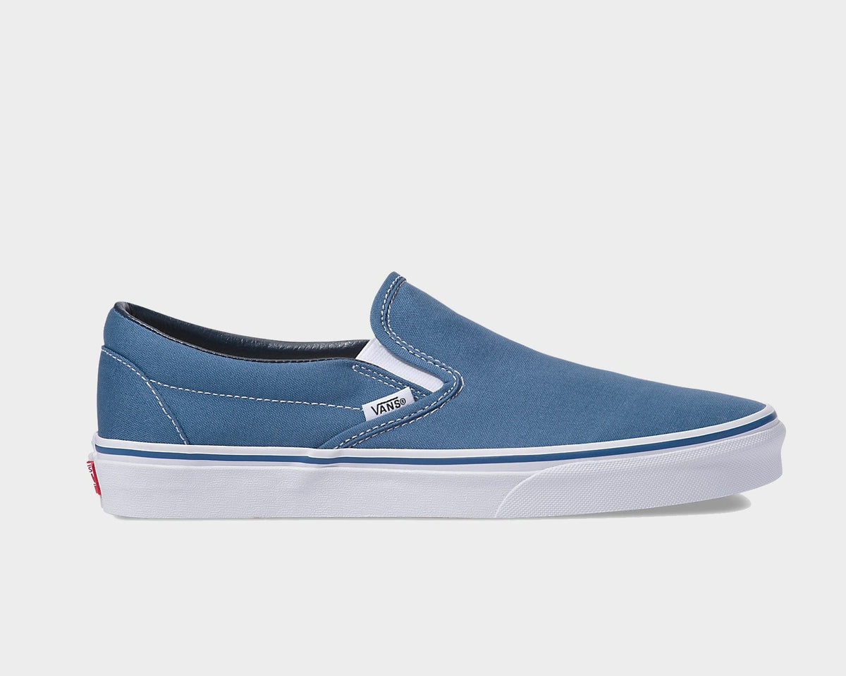 Blue canvas slip-on sneaker with white sole and Vans side logo patch
