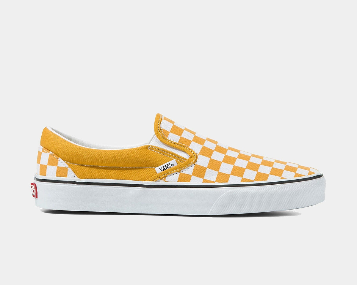 Checkerboard slip-on shoes, orange and white checker pattern, low-profile Vans.