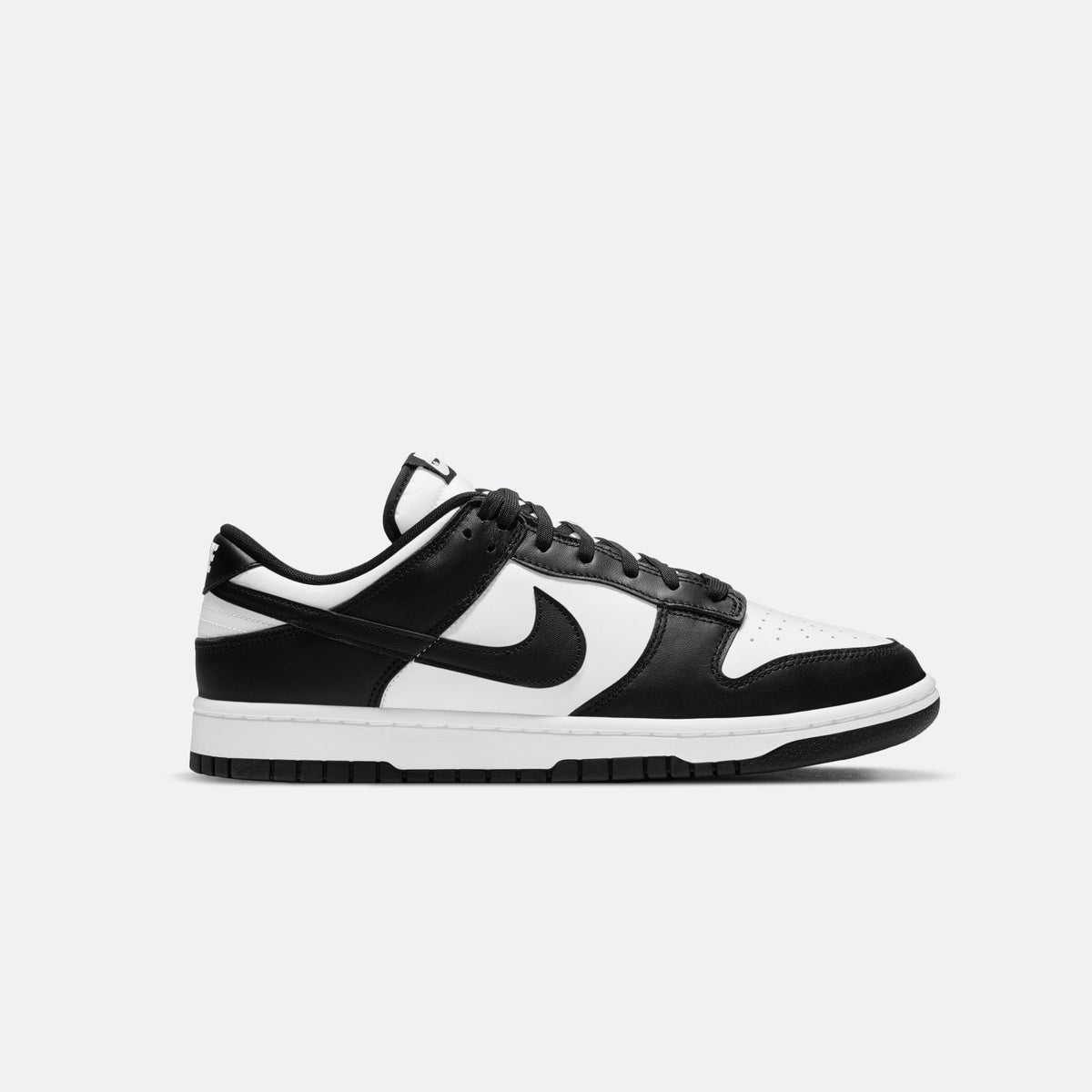 Women's Nike Dunk Low sneakers, white and black low-top with Swoosh and lace-up