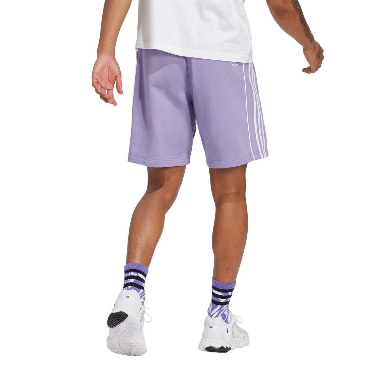Lavender athletic shorts, knee length, with elastic waist and three white side stripes