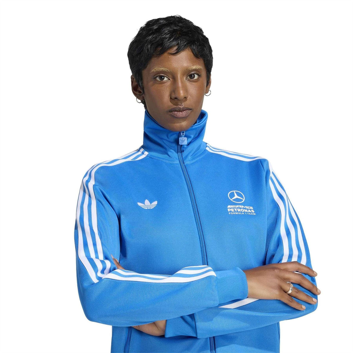 Blue track top with white stripes, adidas trefoil, and Mercedes badge; zip closure.